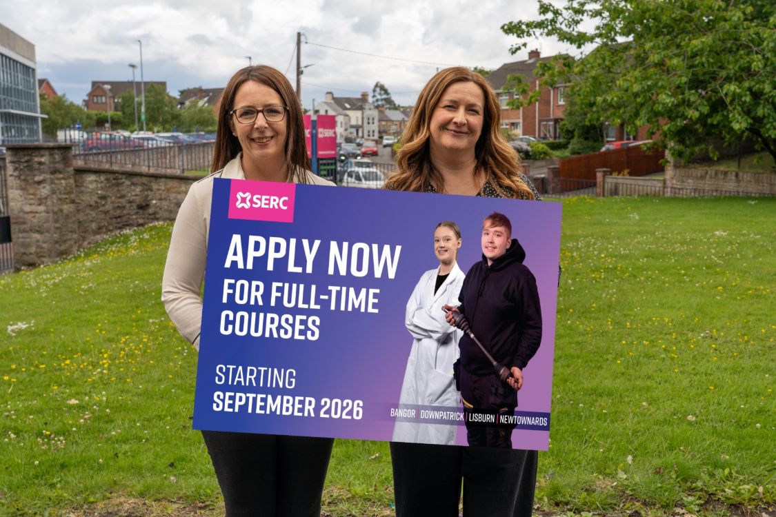 Picture of members of SERC's careers team holding up a sign saying "apply now"